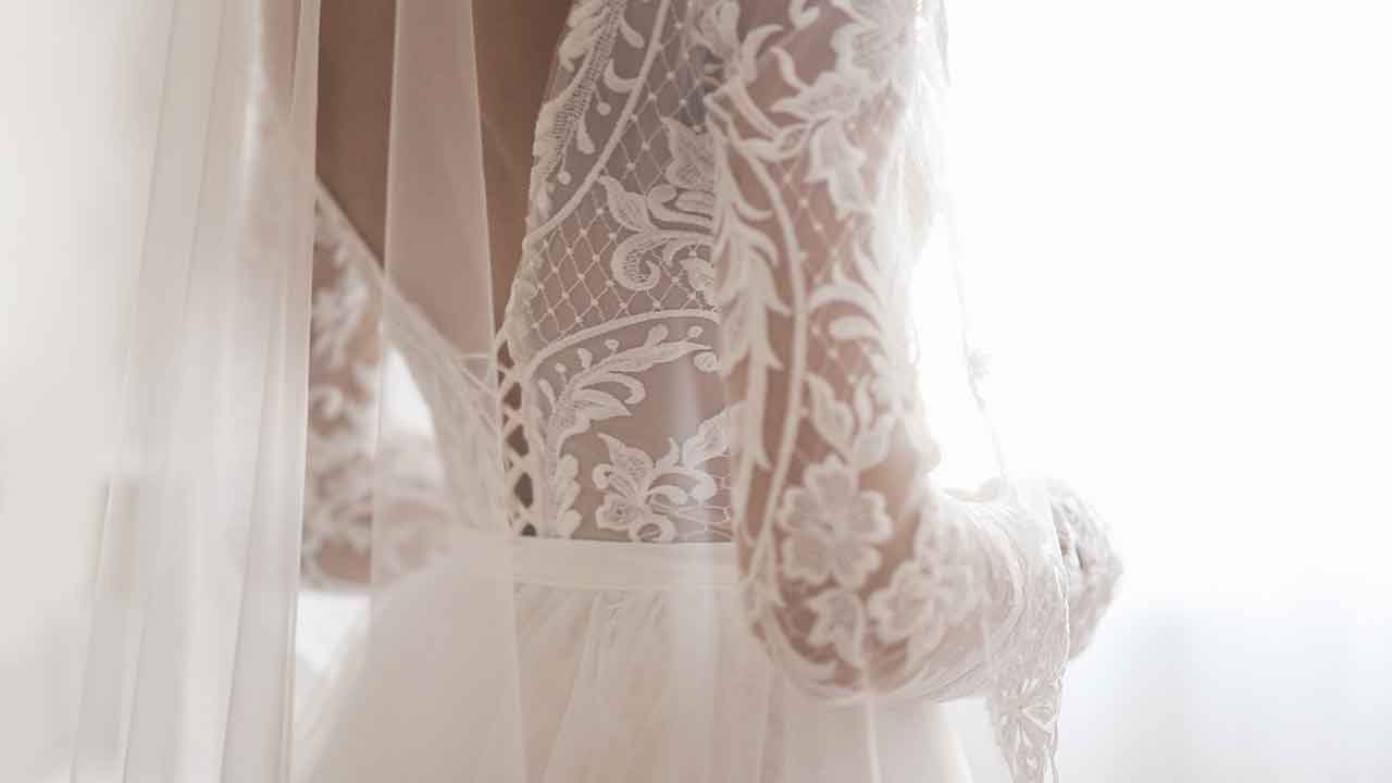 A bride in a white wedding dress with a veil.