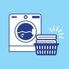 Illustration of a washing machine and a basket with folded laundry on a light blue background.