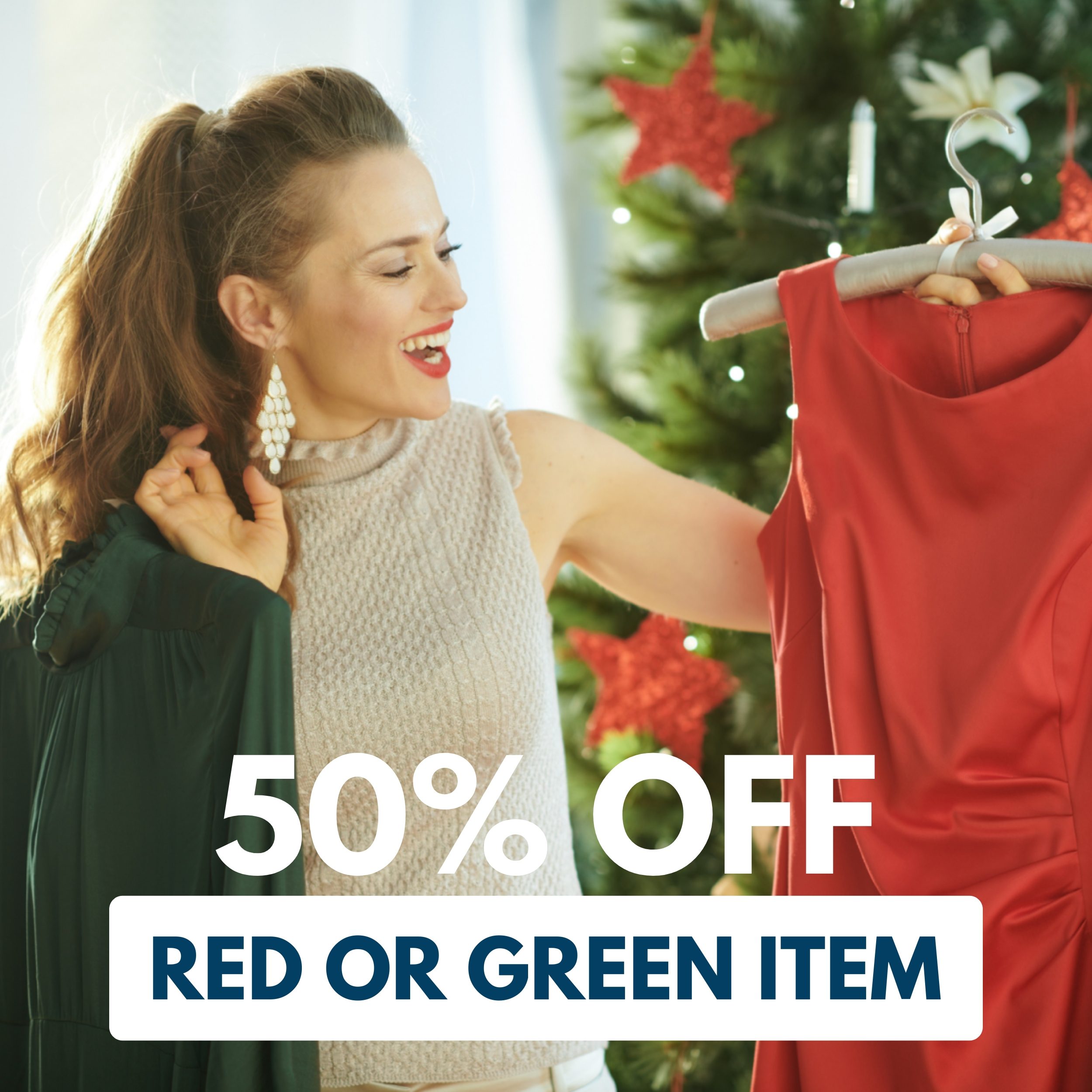 Woman holding a green dress and a red dress near a decorated Christmas tree, with text overlay stating "50% off red or green item.