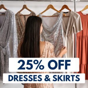 A woman in a sparkly dress looks at dresses on hangers, with a sign in front reading "25% OFF DRESSES & SKIRTS.