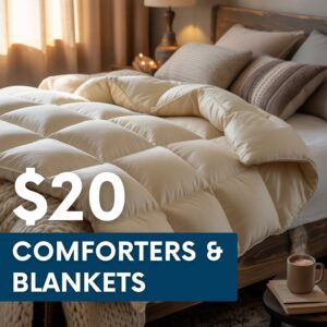 A neatly made bed with a thick cream-colored comforter, pillows, and a knit blanket, with a $20 comforters & blankets sale promotion displayed.