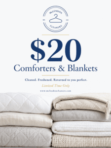 Stacked folded comforters and blankets with text advertising $20 cleaning at McLendon Cleaners, featuring their logo and a limited time offer.