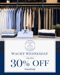 A clothing store display with folded shirts and stacked pants. A sign in front reads: "Wacky Wednesday, July 22nd, 30% off everything, McLendon Cleaners.
